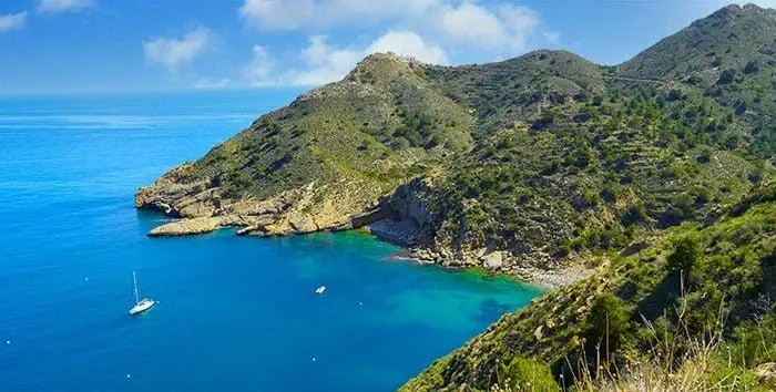 Coves for anchoring in Altea seen from a boat on the Costa Blanca with crystal clear waters