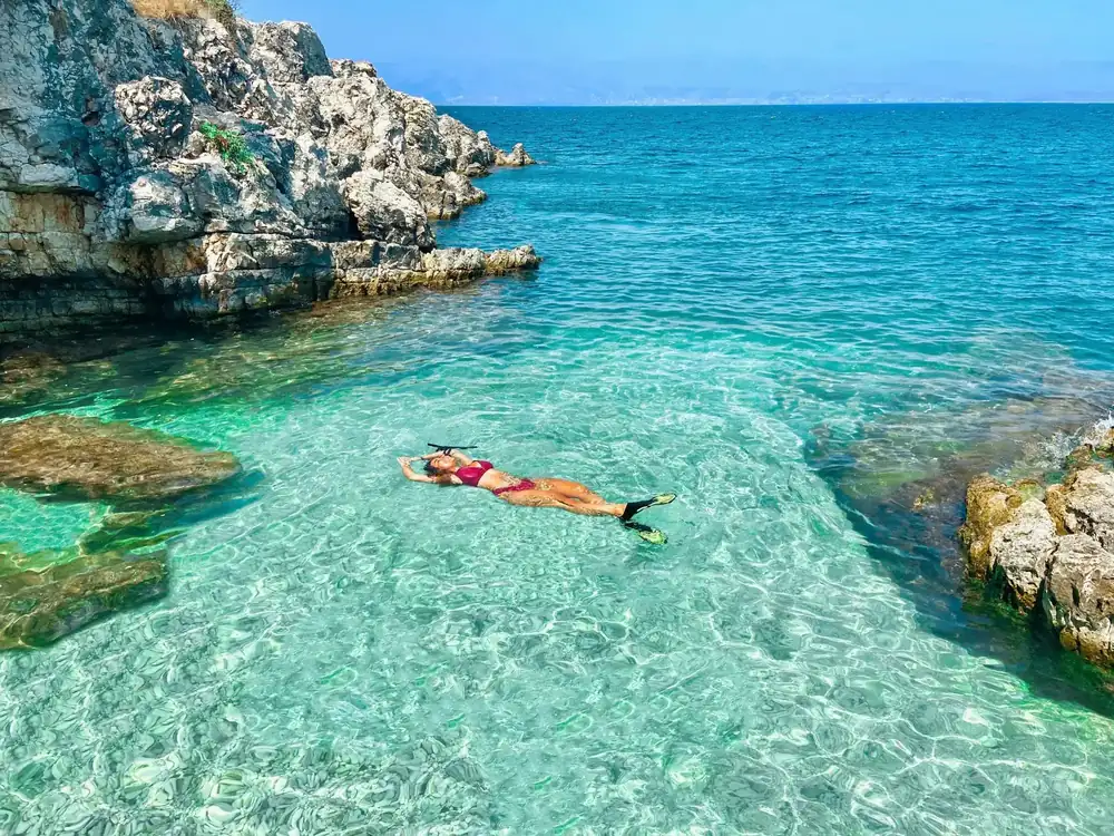 Snorkelling in crystal clear cove Altea from boat - water activities Costa Blanca