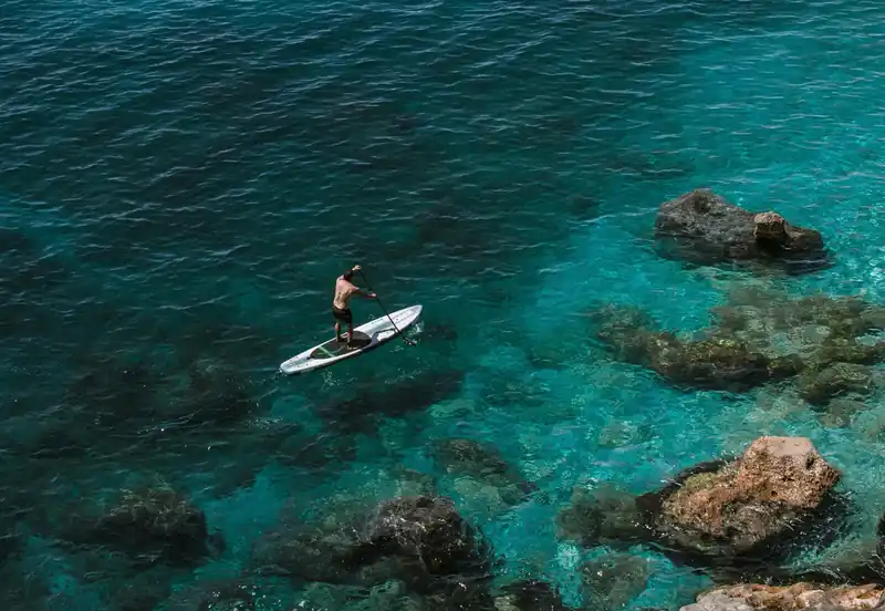 Paddle surf in crystal clear waters from boat - water activities Costa Blanca